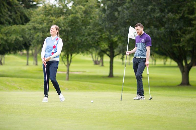 Golfers playing